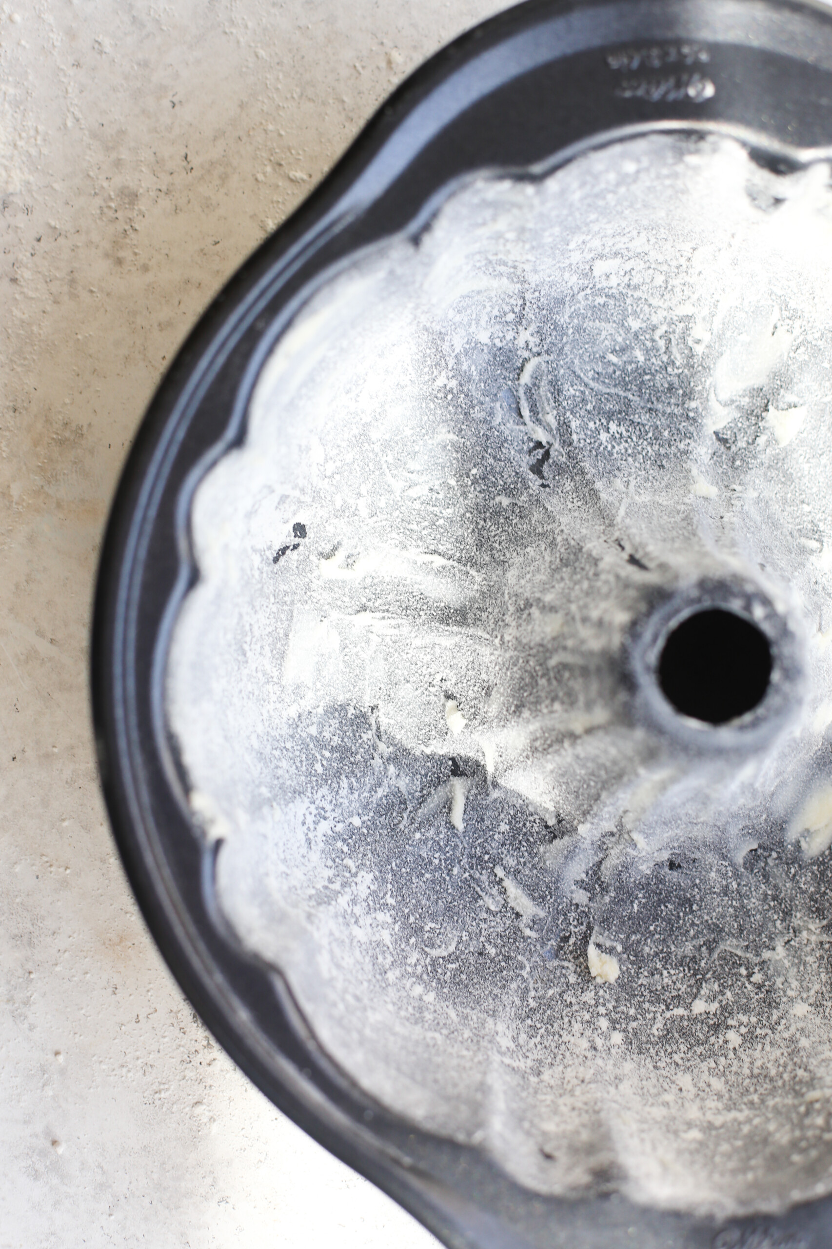 Lemon Bundt Cake Showing Buttered, Sugared and Floured Bundt Pan